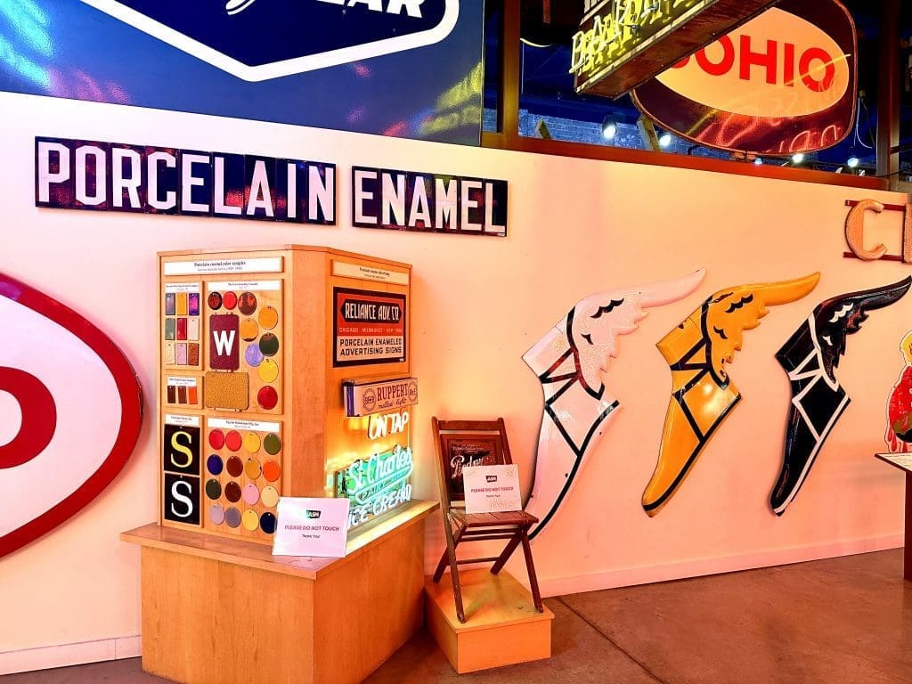 Colorful retro vending machine and wall art in a vintage diner.