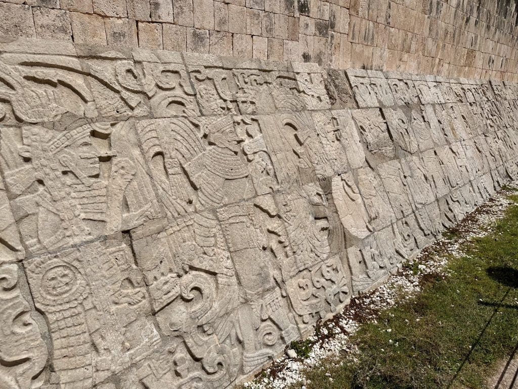 Bas-reliefs, on Great Ball Court walls, depict Maya sacrifices.