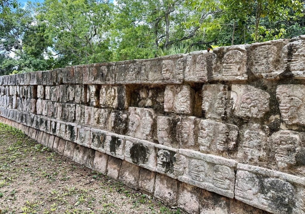 Tzompantli honors families of those sacrificed with over 500 bas-relief skulls carved.