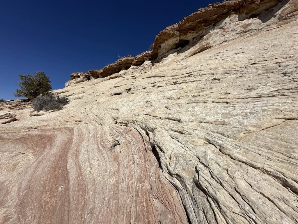 Sides of Aztec Butte is slickrock, ledges and cliffs
