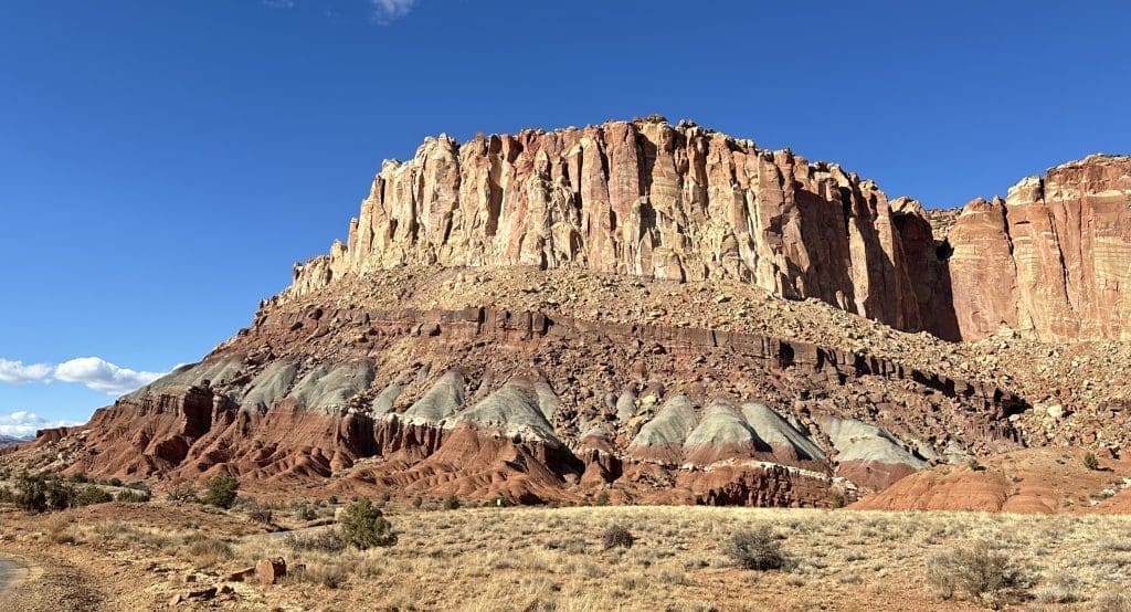 Vivid rock colors peek at the Grand Wash entrance on Scenic Drive in Capitol Reef.
